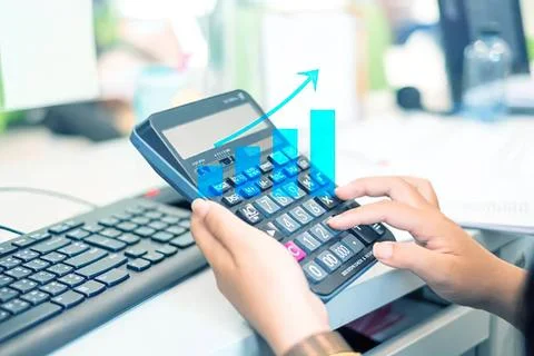 Person using calculator with rising graph for finance analysis Stock Photos