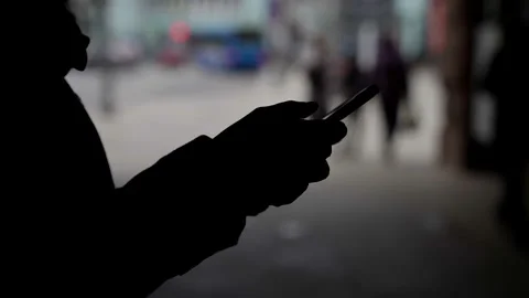 Person is using cell phone, sending message, scrolling touch screen, closeup of Stock Footage 154502527