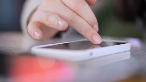 Person is using a cell phone to touch the screen Stock Footage 305625613