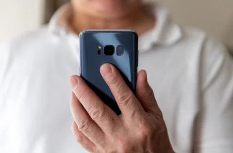 A person using a cellphone. Stock Photos
