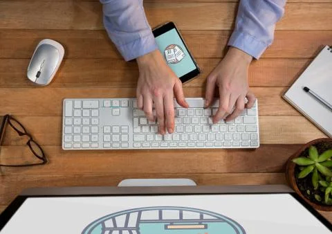 Person using a computer and mobile phone with travel icons on the screen 스톡 사진