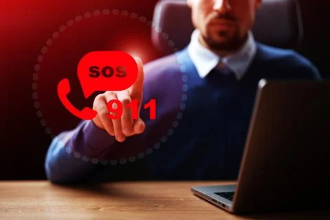 Person using computer to call emergency services with 911 and SOS displayed on Stock Photos