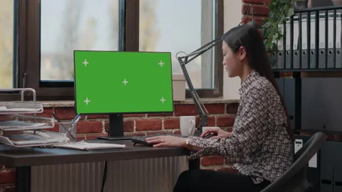Person using computer with green screen in business office Stock Footage 166012203