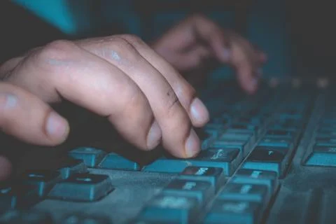 A person using a computer keyboard. Stock Photos