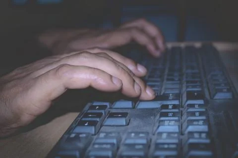 A person using a computer keyboard. Stock Photos