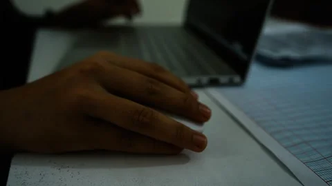 Person Using Computer Mouse at Desk, A person using a computer mouse with a.. Stock Footage 304977555