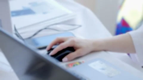 Person is using a computer mouse on a laptop Stock Footage 310977984