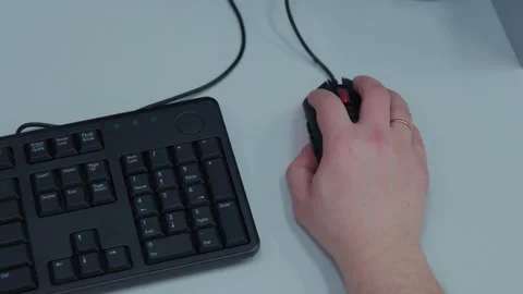 A person is using a computer mouse while playing video games Stock Footage 276969828