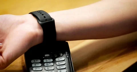 Person using contact less payment with smartphone payment terminal Point of Sale Video stock 336585627