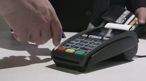 Person using credit card processing terminal in Ukraine Stock Footage 47864506