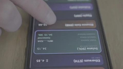 Person using decentralized finance application for crypto asset Stock Footage 337998375