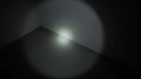 Person Using Flashlight in Dark Stairwell During Blackout 스톡 동영상 327331256