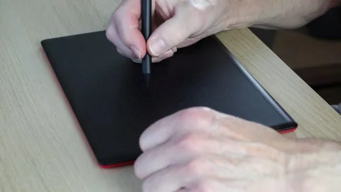 Person using graphic tablet to write and edit files, close up Stock Footage 242603110