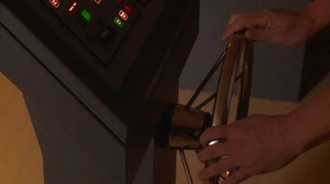 A person using the helm of the ship. Ship maneuvers simulator. Stock Footage 66446912