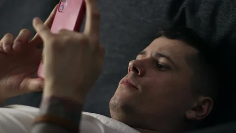 A person using his smartphone, browsing social media and get surprised Stock Footage 150169467