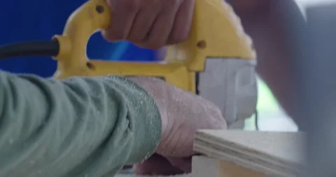 Person Using a Jig Saw to Cut Wood Stock Footage 200842966