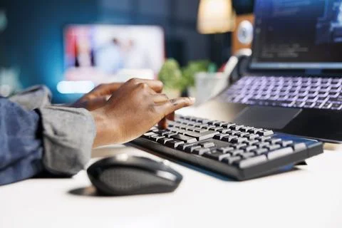 Person using keyboard to type in code Stock Photos