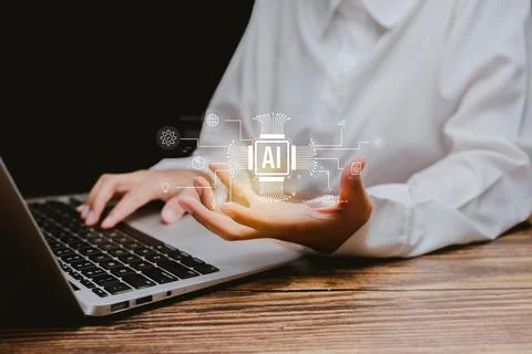 Person Using Laptop with AI Technology and Digital Graphics, Business concept Stock-Fotos