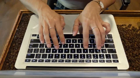 A person using a laptop computer sitting on top of a keyboard Stock Footage 155539774