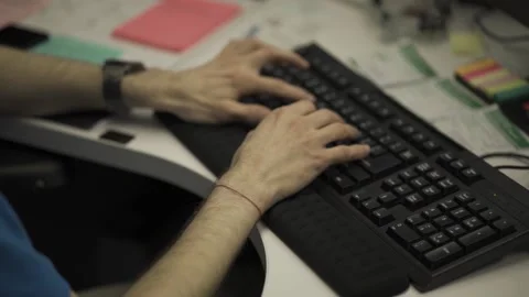 A person using a laptop computer sitting on top of a keyboard Stock Footage 155540643