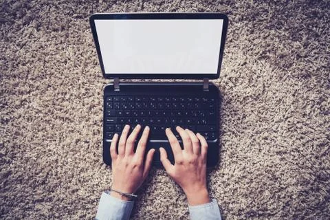 Person using laptop computer with white blank screen Stock Photos