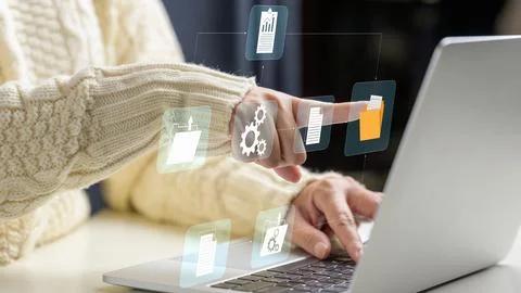 Person using laptop with digital document management system icons, represen.. 스톡 사진