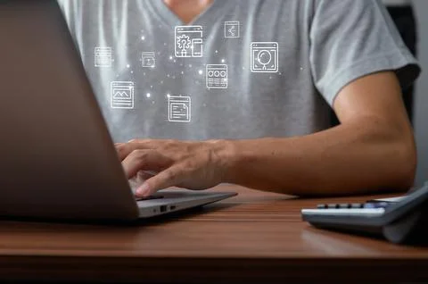 Person Using Laptop with Graphics of Browser and Interface Elements Stock Photos