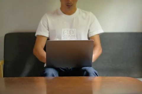 Person Using Laptop with Notification Icon in Modern Workspace Stock Photos