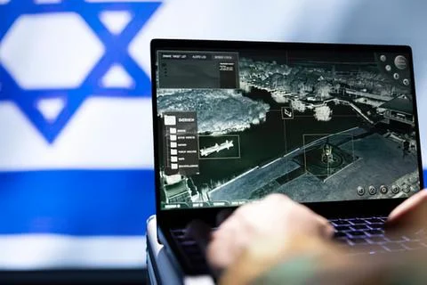 Person using laptop showing drone surveillance footage with israeli flag ba.. Stock Photos