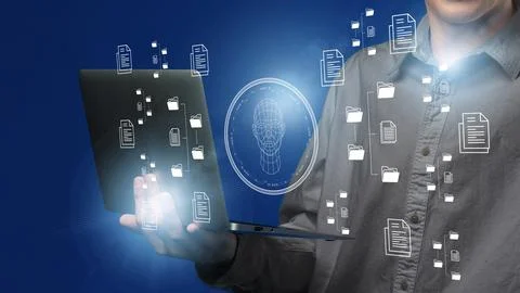 Person using a laptop with visual effects showing data and a face recognition Foto stock