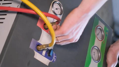 Person is using a machine with an attached hose for operation Stock Footage 271380636