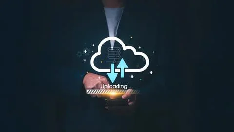 Person using mobile phone with cloud upload icon Stock Photos