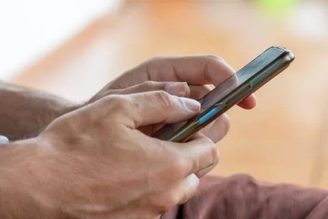 Person using mobile phone for digital communication Stockfoto's
