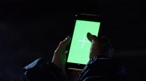 Person using a mobile phone with green screen Stock Footage 67553776