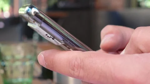 Person using mobile phone, writing sms Vidéo 310408319