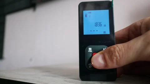 Person Using Modern Laser Distance Meter for Interior Measurement Vidéo 339361498
