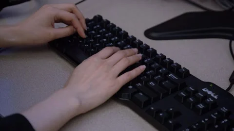 A person using a mouse and keyboard Video stock 155536313