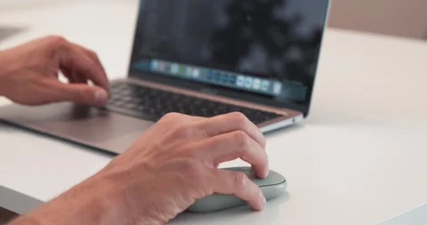 Person using mouse and laptop to navigate screen zooming in and out, Stock Footage 244103169
