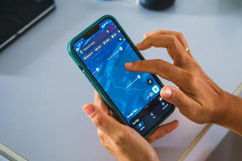 Person using navigation map app on smartphone screen 写真素材