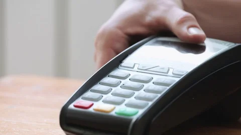 Person using NFC technology on smart phone to pay Stock Footage 79901544