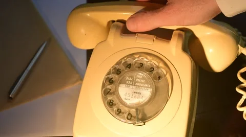 Person using old style rotary dial telephone Stock Footage 58810549