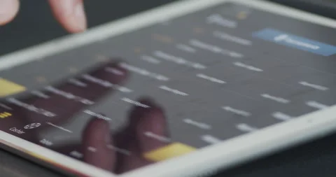 Person using online gambling application bet365 from tablet device at home Stock Footage 130393710