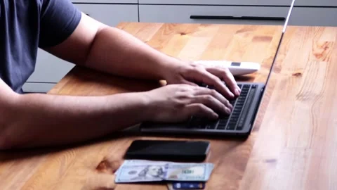 A person using a personal computer with their hand on the laptop, making a Stock Footage 263968966