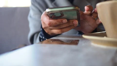 Person using phone scan the QR code to find the menu at cafe table Stock Footage 327112660