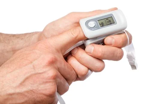 Person using pulse oximeter to check oxygen saturation tracking coronavirus s Stock Photos