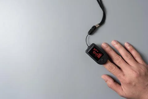Person using pulse oximeter device Stock Photos