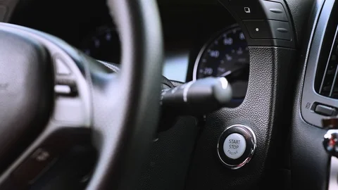 Person using push button car engine ignition start closeup Stock Footage 127111439