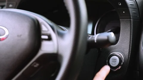 Person using push button car engine ignition start Stock Footage 127111507
