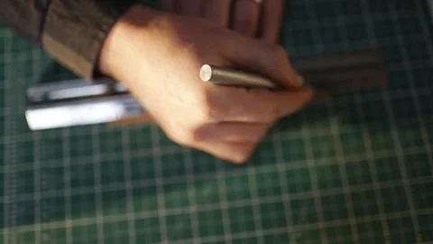 A person is using a ruler to measure something Video stock 302442677