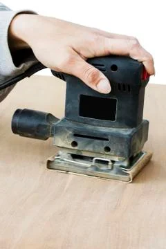 Person using sander Stock Photos